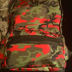 Brand new, authentic, BADGLEY Mischka  Backpack with Red and Green Accents